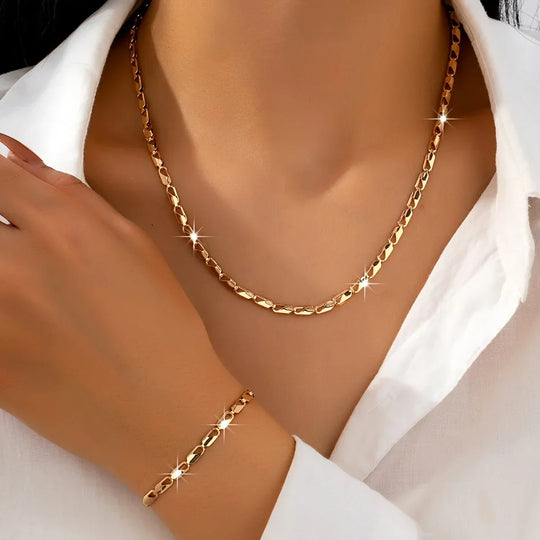 Elegant halskæde- og armbåndssæt i 18 karat guld