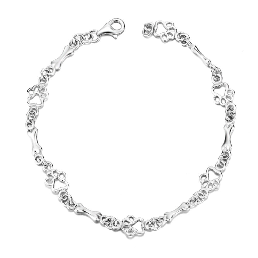 Silberarmband mit Pfotenabdruck und Knochenmotiv