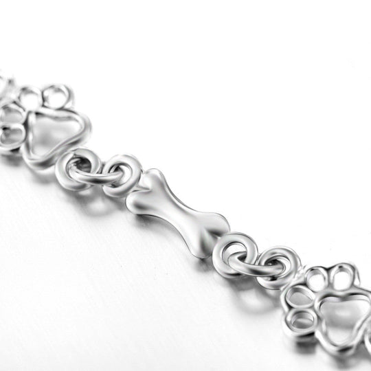 Silberarmband mit Pfotenabdruck und Knochenmotiv
