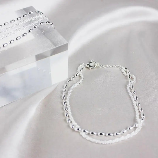 Elegant sølvarmbåndssæt med zirkoniasten